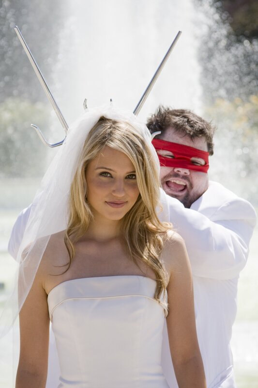 Bride with blindfolded groom