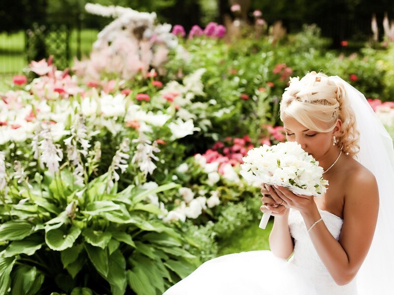 Bride with bouquet in garden