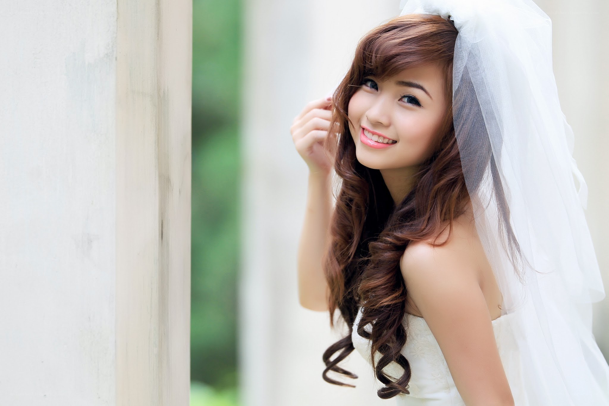 Bride with veil smiling