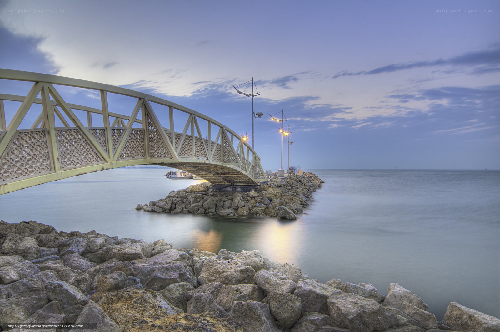 Bridge at dusk over calm sea