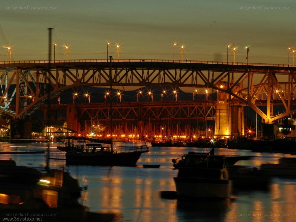 Bridge at dusk with boats