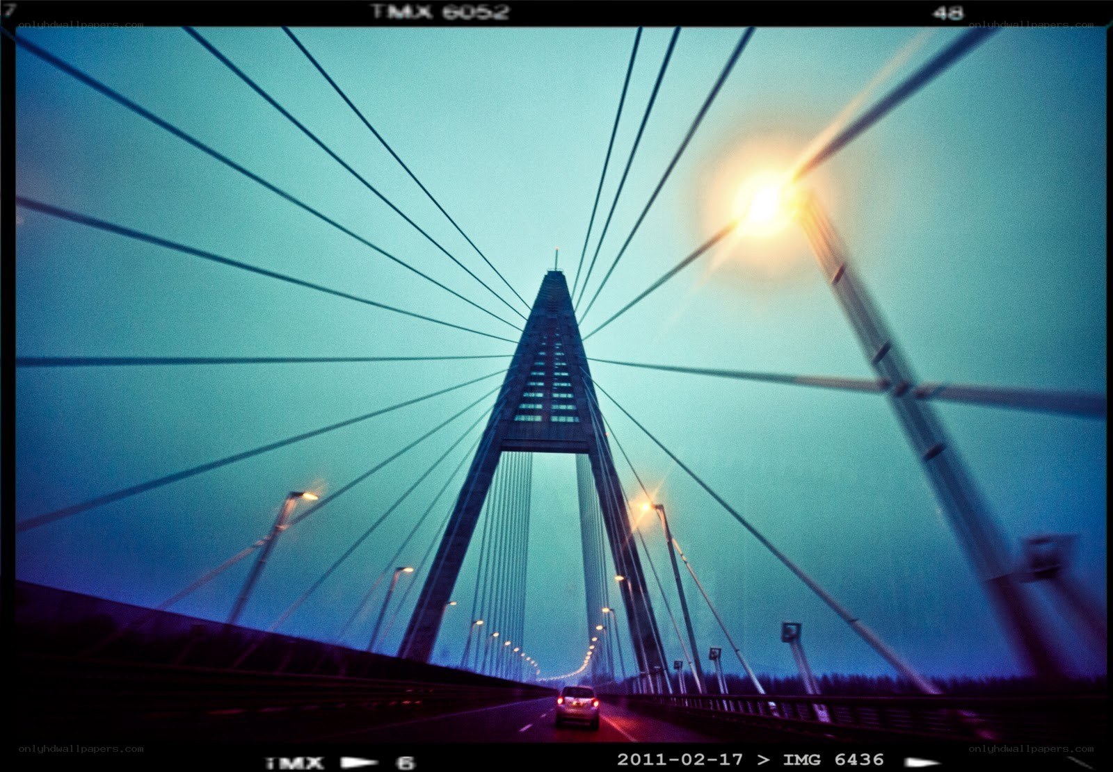 Bridge at dusk with car