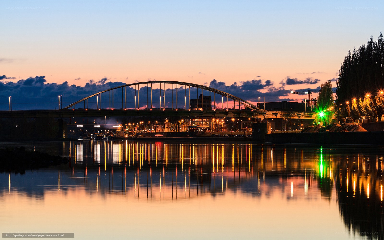 Bridge at dusk with city lights
