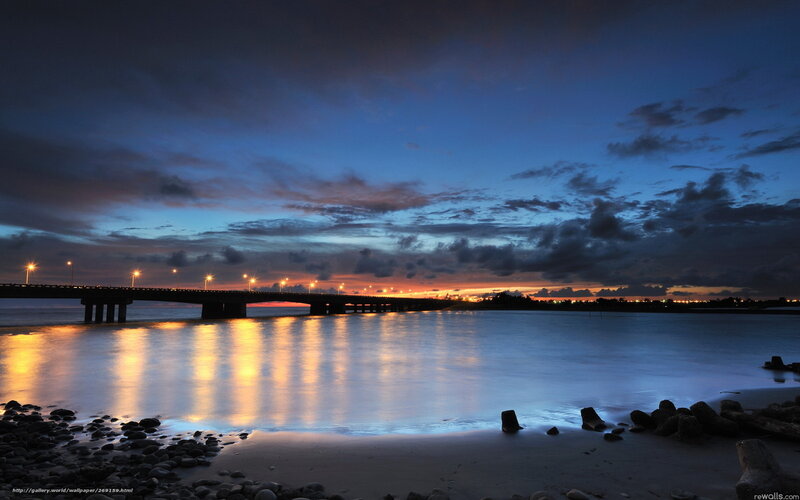 Bridge at dusk with city lights
