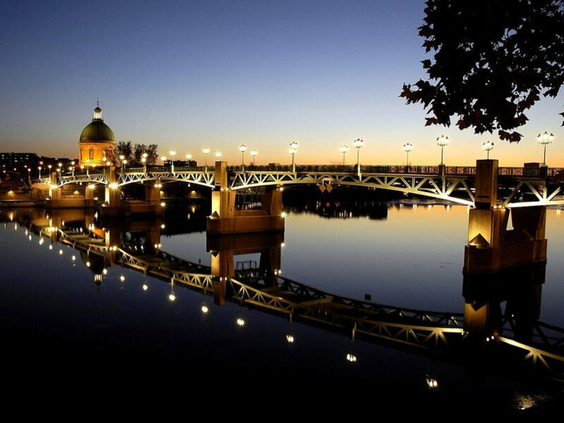 Bridge at dusk with dome in background