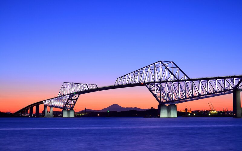 Bridge at dusk with mountain view