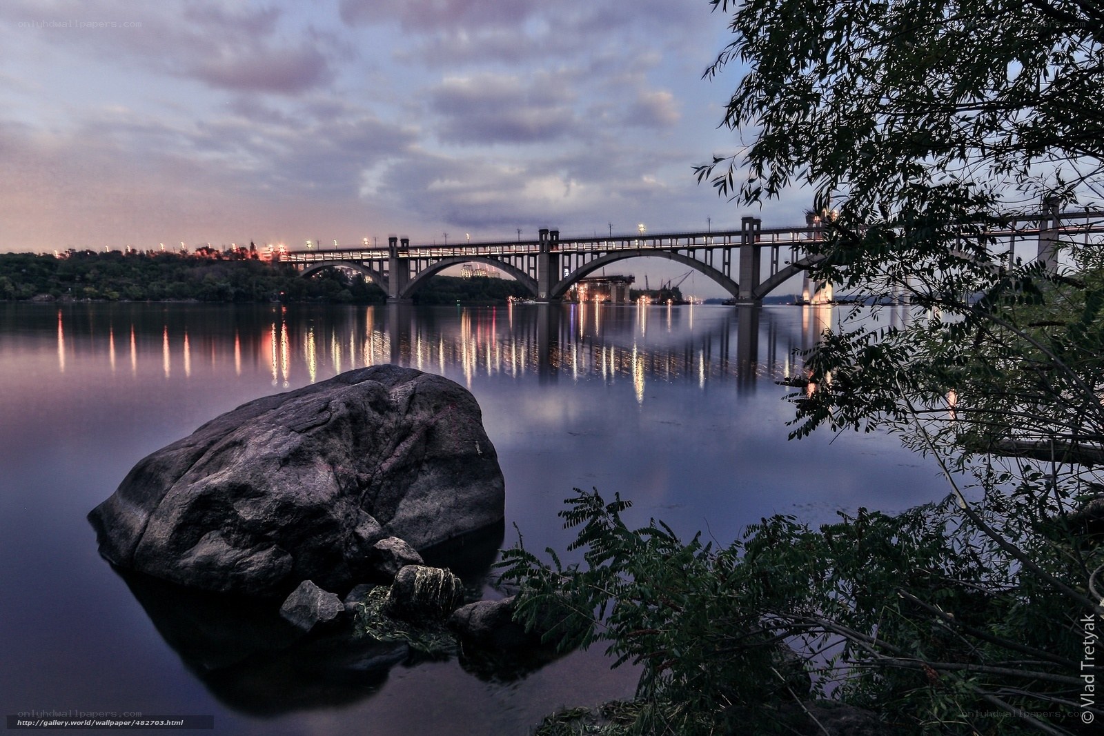 Bridge at dusk with rock in foreground