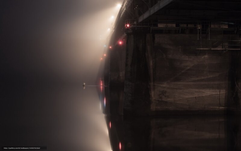 Bridge at night in fog
