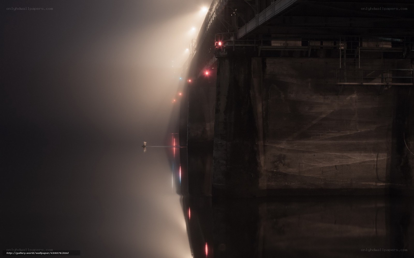 Bridge at night in fog