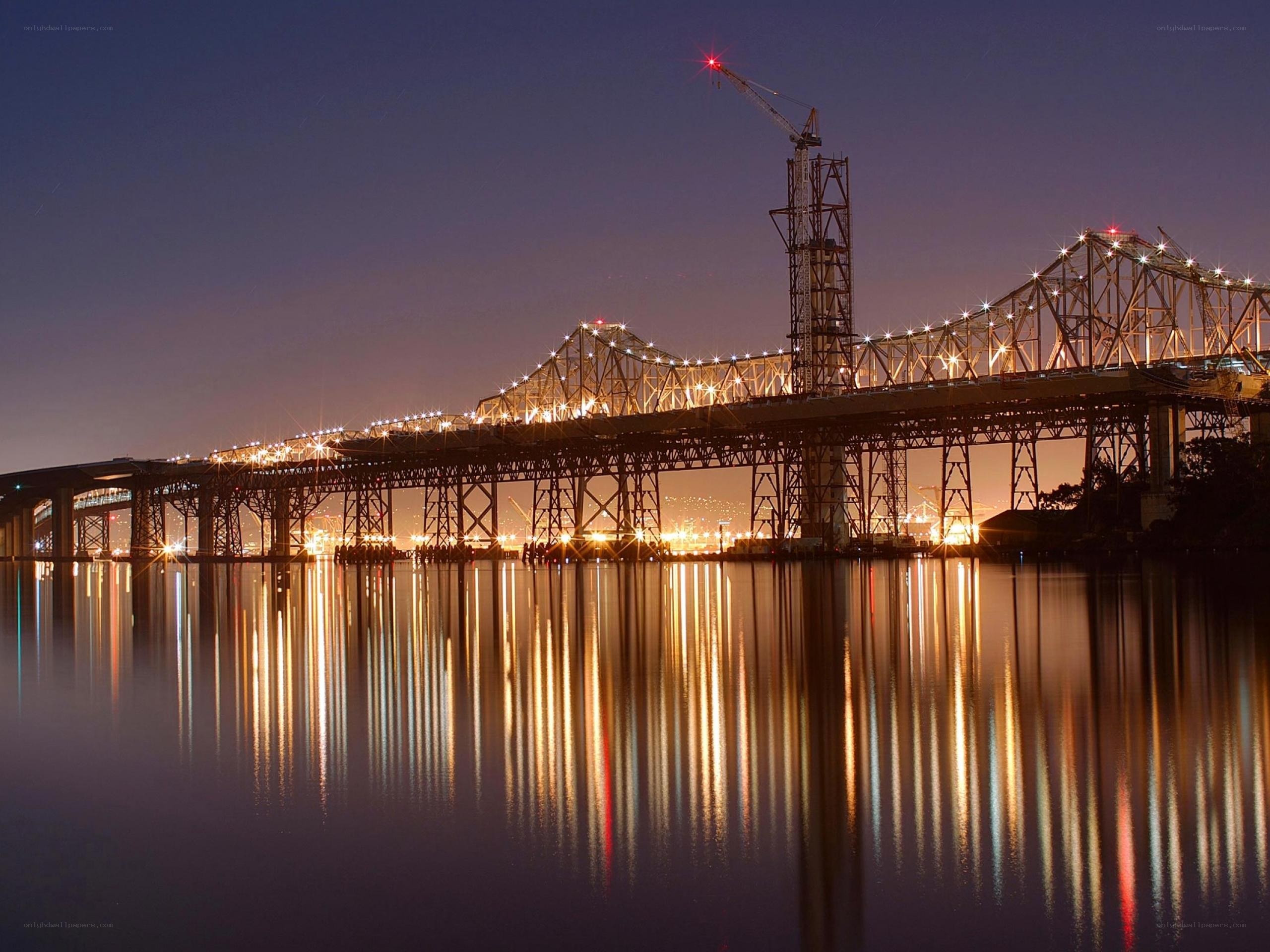 Bridge at night with crane
