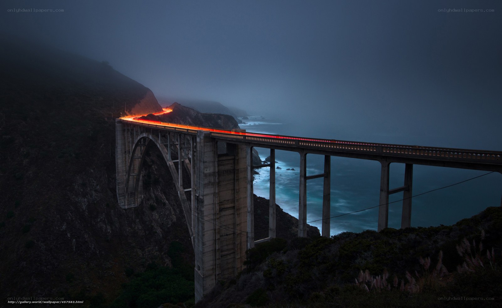Bridge at night with light trails