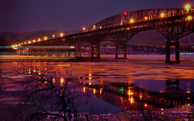 Bridge at night with light trails