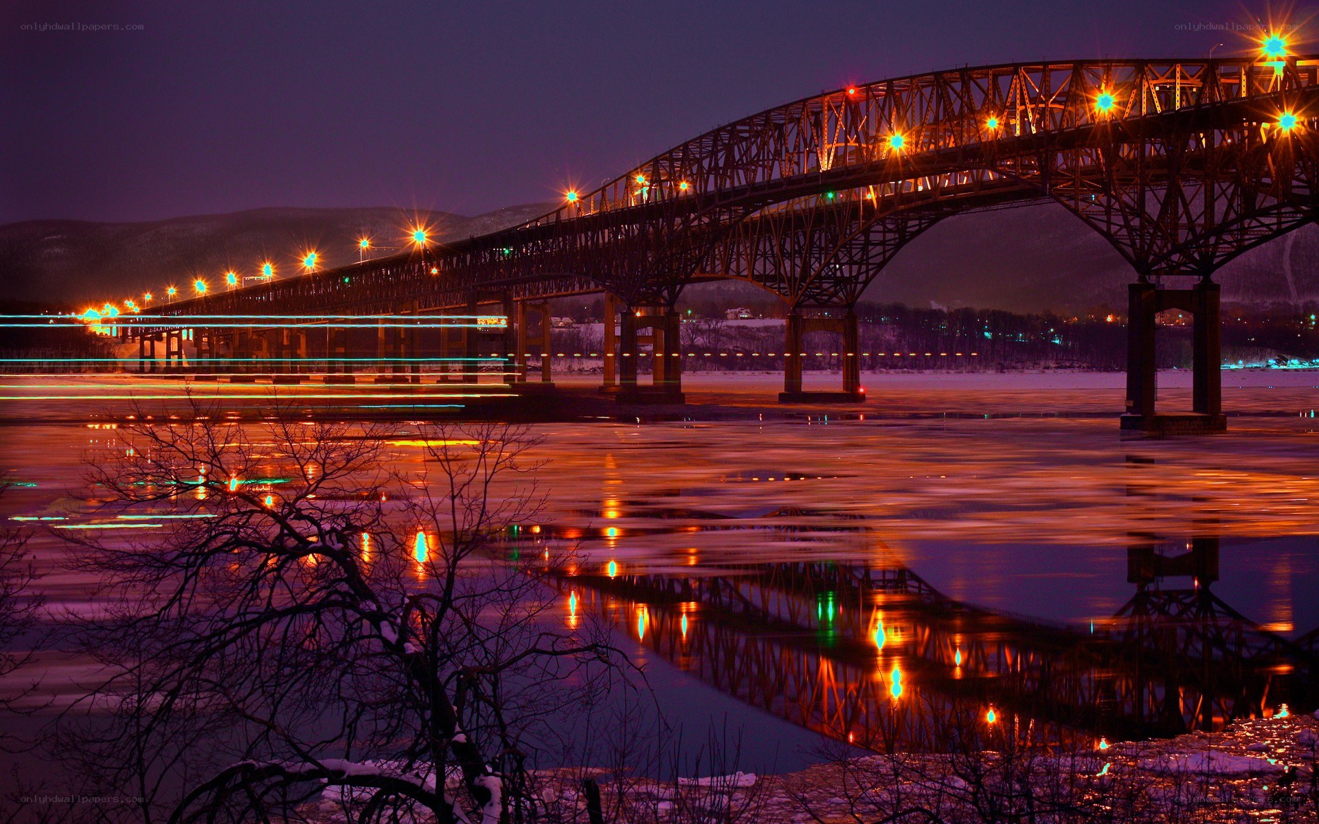 Bridge at night with light trails