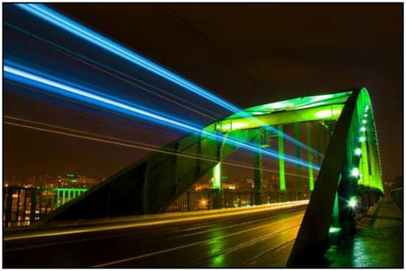 Bridge at night with light trails