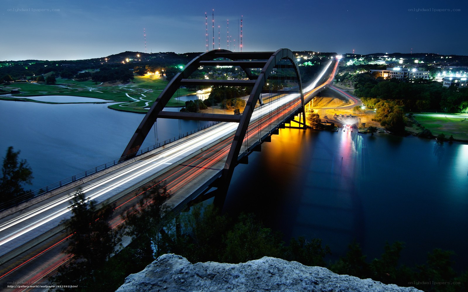 Bridge at night with light trails