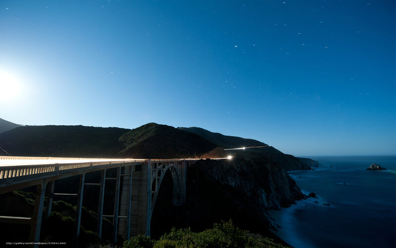 Bridge at night with star trails