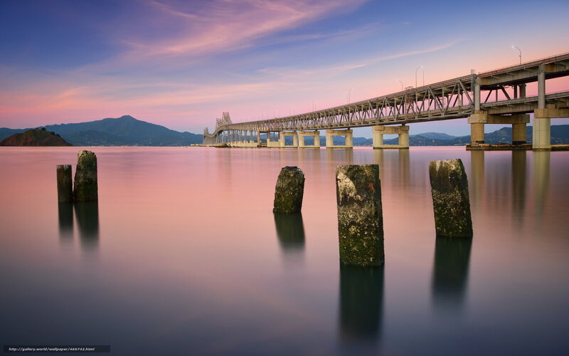 Bridge at sunset with calm water