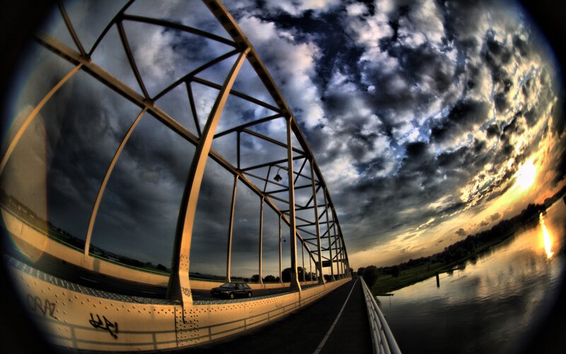 Bridge at sunset with dramatic sky
