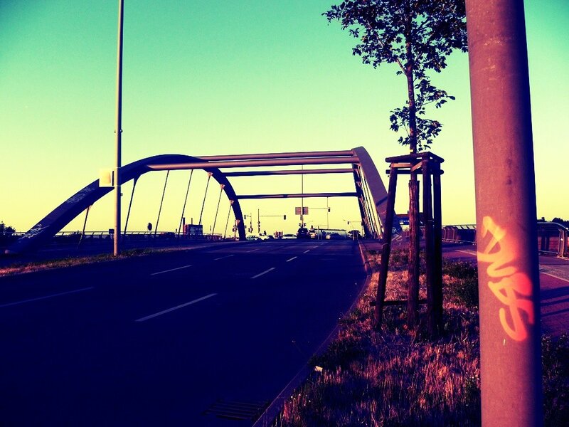 Bridge at sunset with graffiti