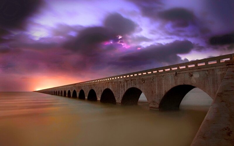 Bridge at sunset with lightning