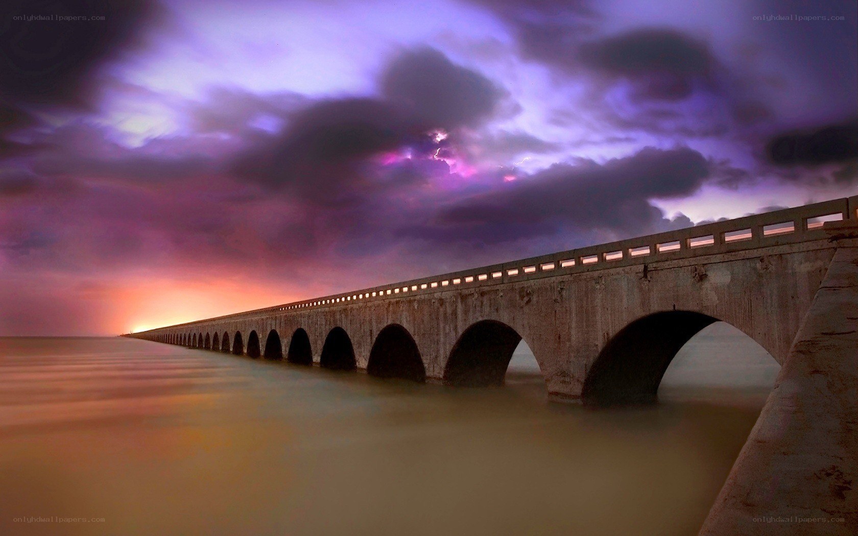 Bridge at sunset with lightning