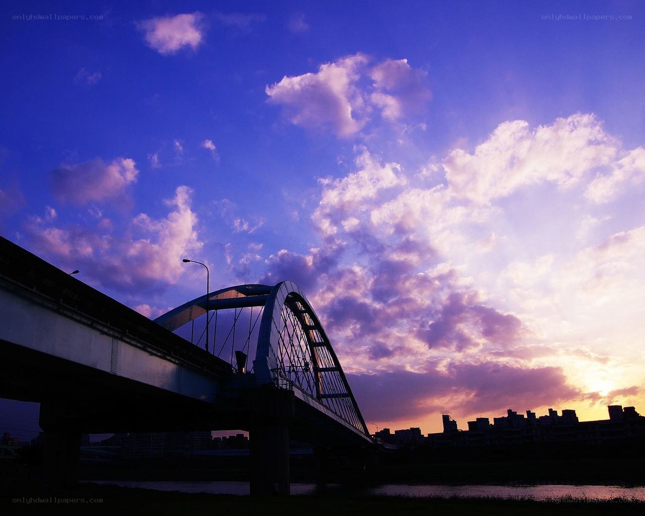 Bridge at sunset with purple sky