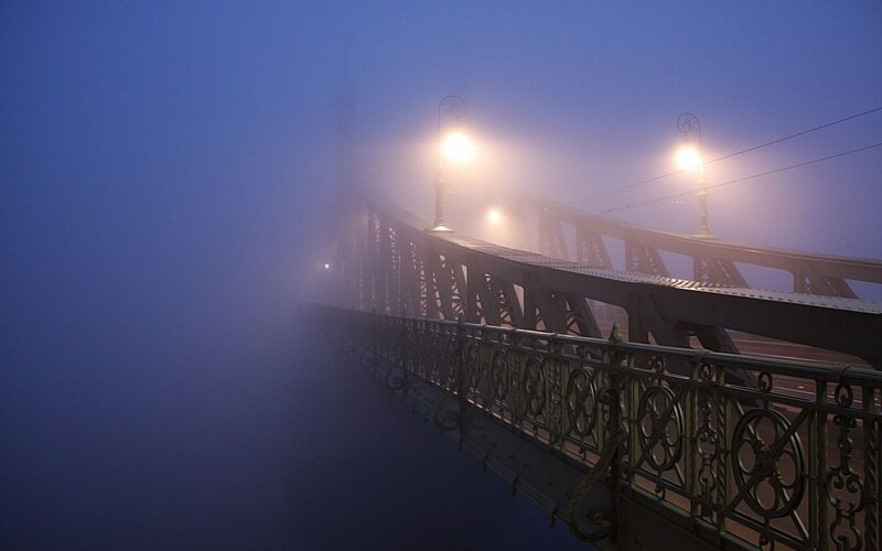 Bridge in the fog at night