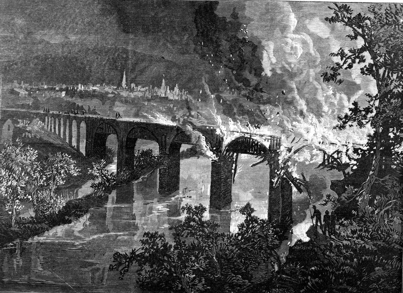 Bridge on fire during conflict