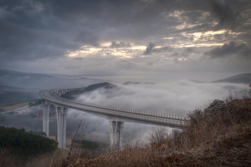Bridge over a foggy valley