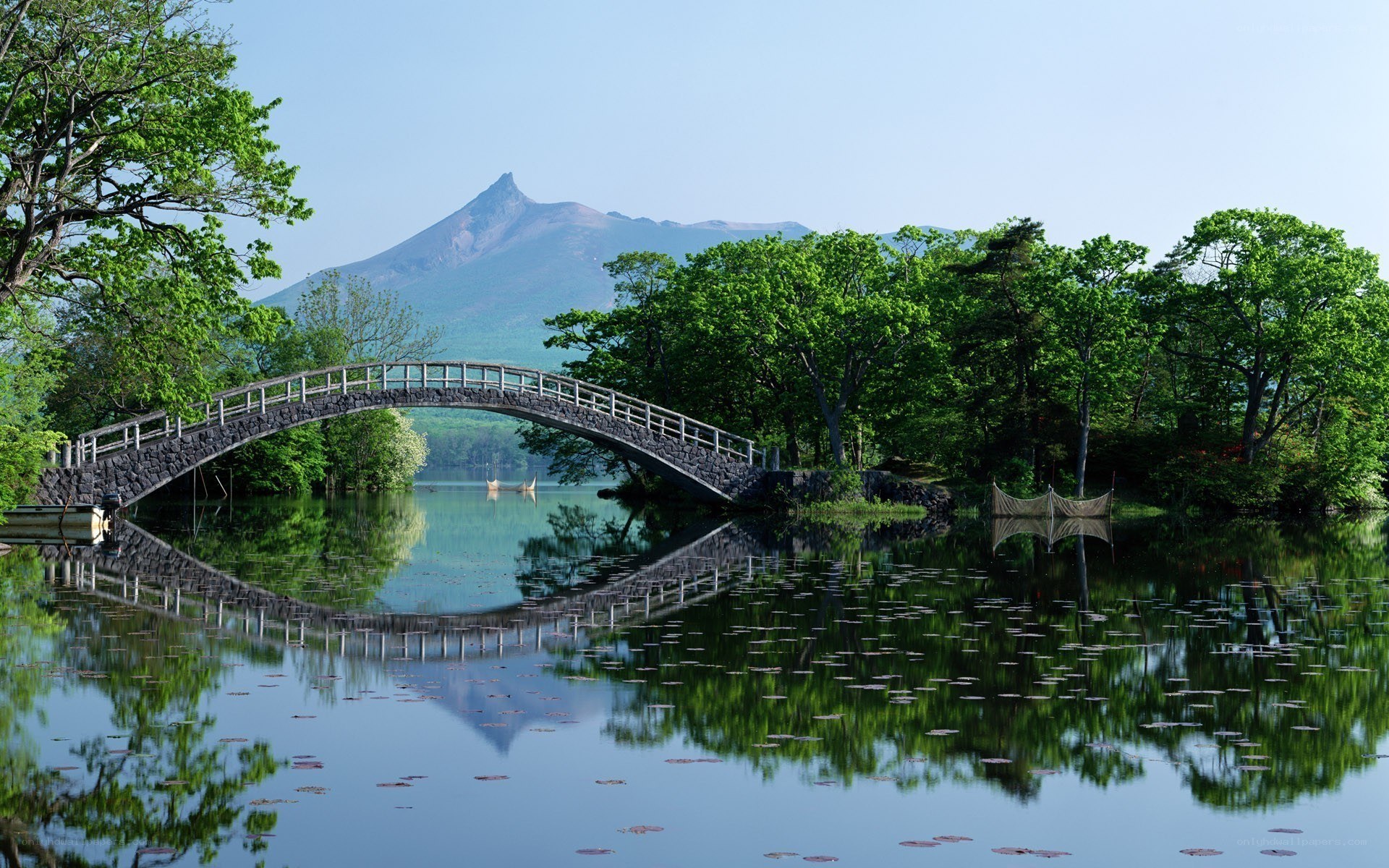 Bridge over a lake with mountain view