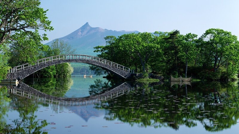 Bridge over a lake with mountain view