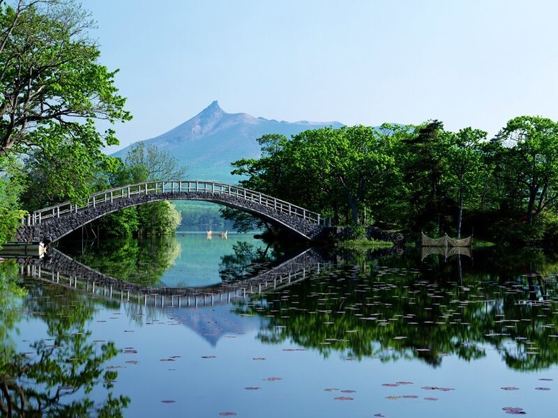 Bridge over a lake with mountain view