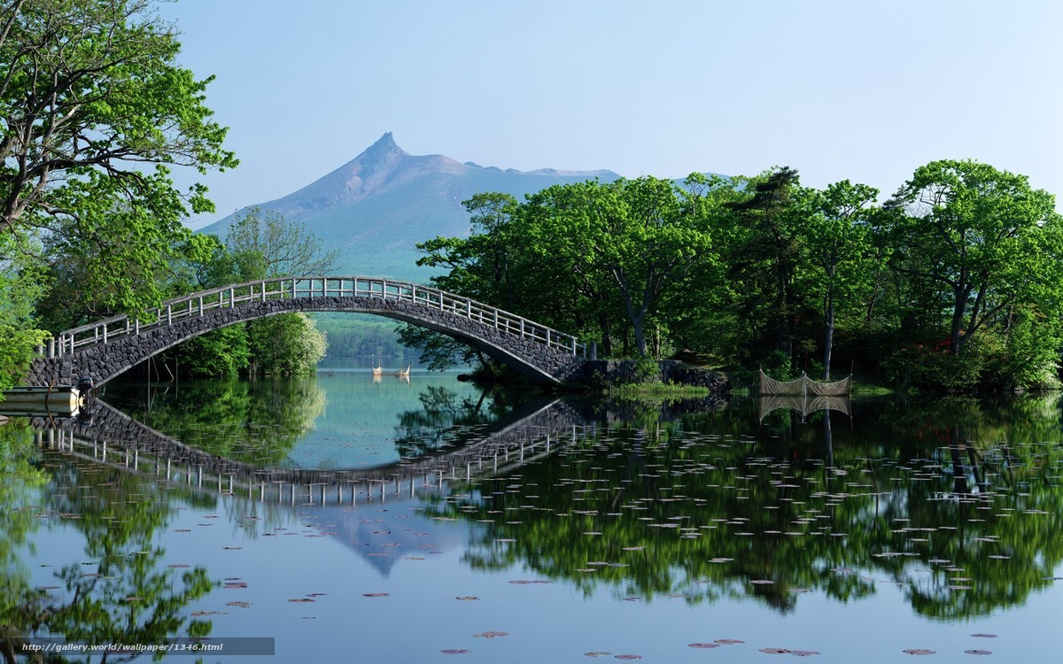 Bridge over a lake with mountain view