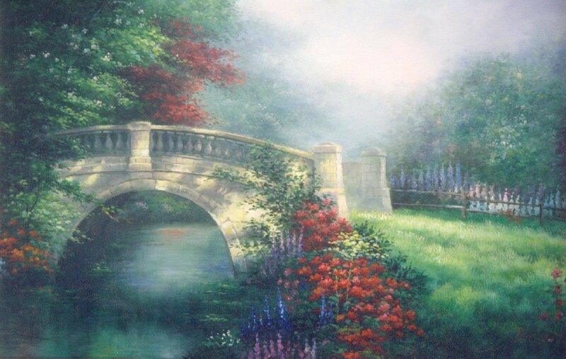 Bridge over a misty garden stream