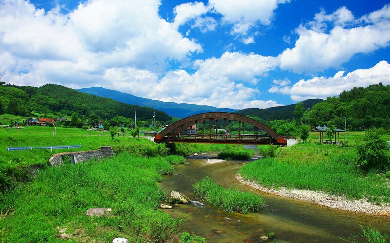 Bridge over a river in a green valley