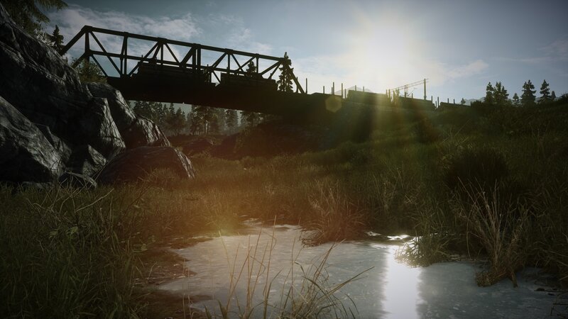 Bridge over a stream at sunset