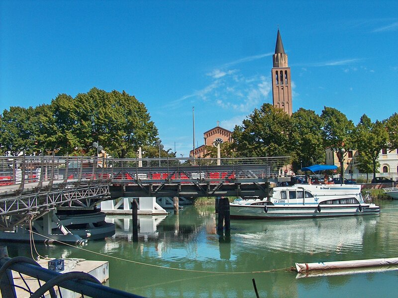 Bridge over canal with church tower