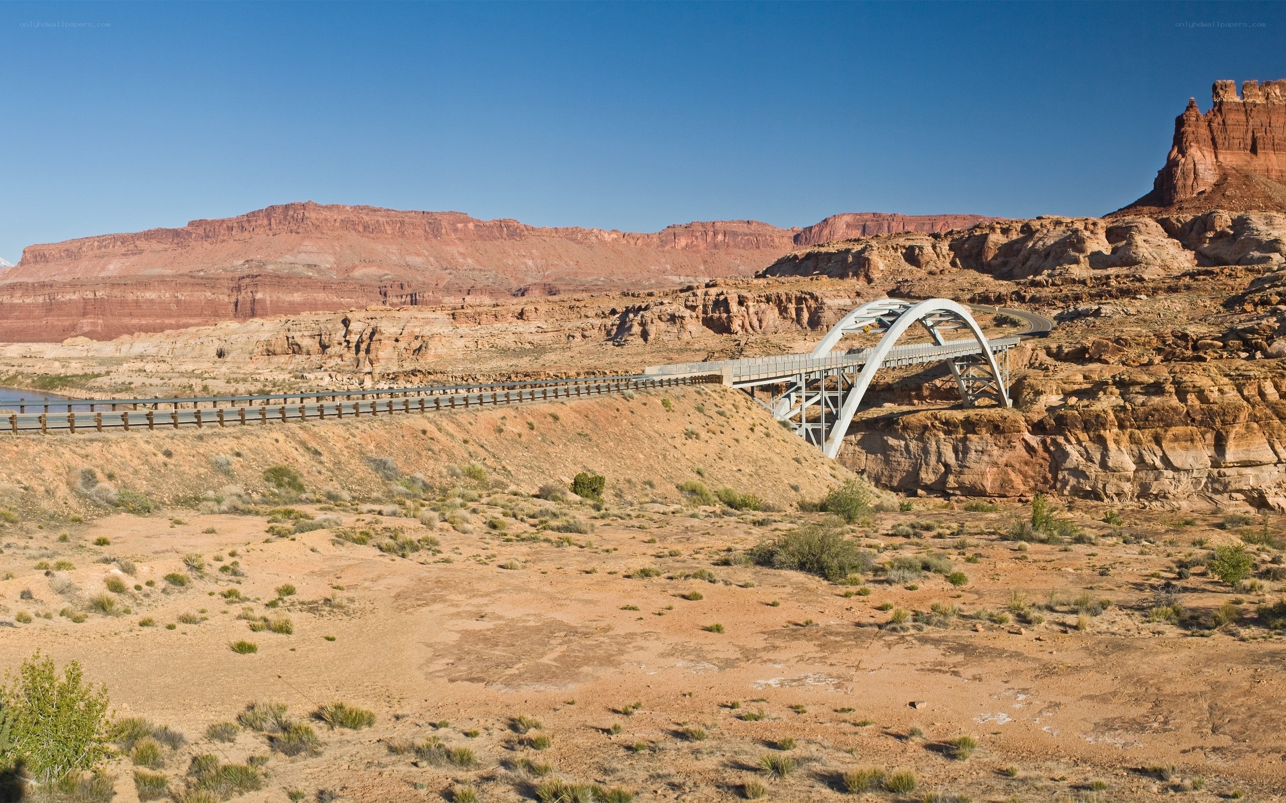 Bridge over canyon in desert