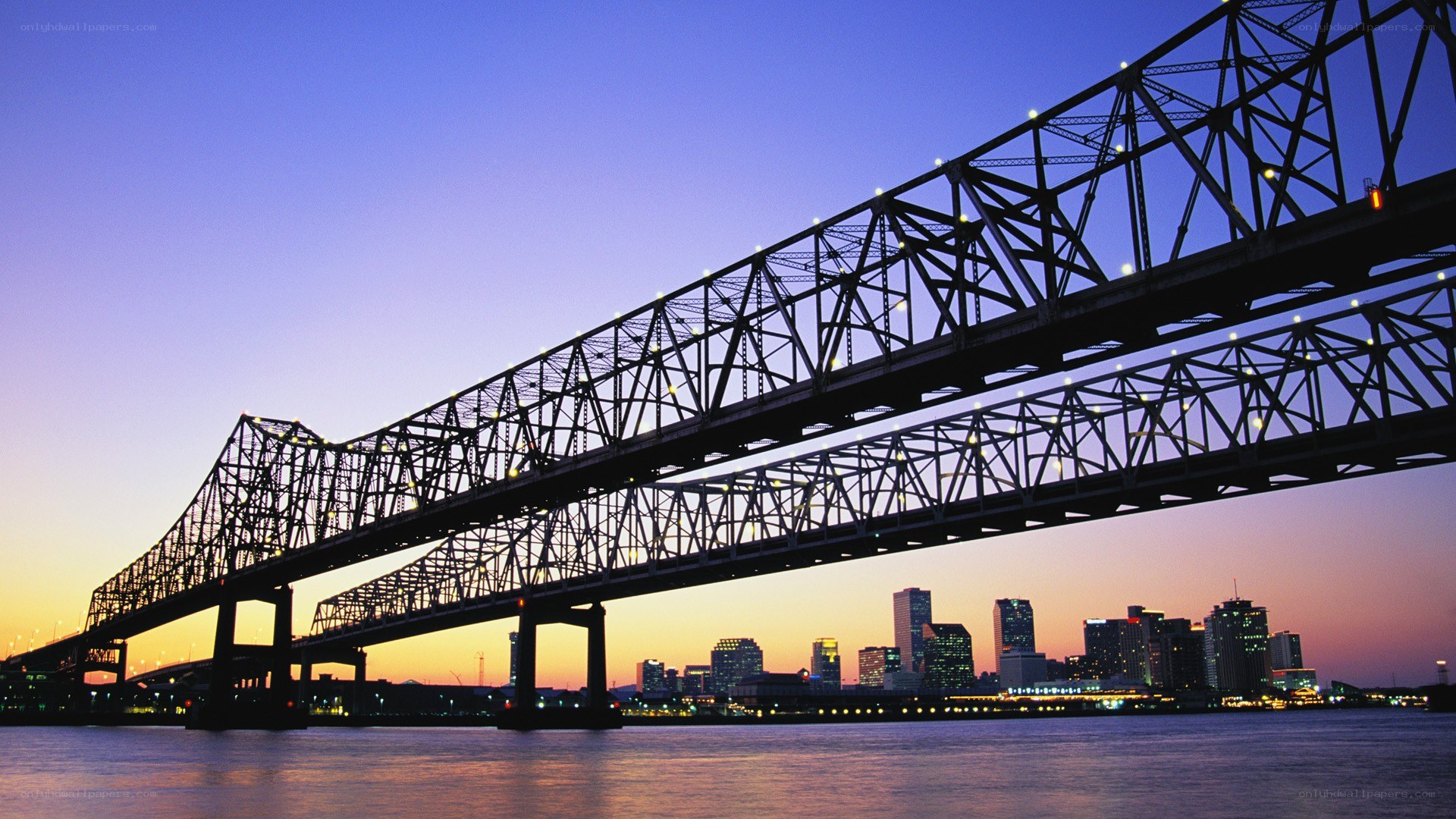 Bridge over city at dusk