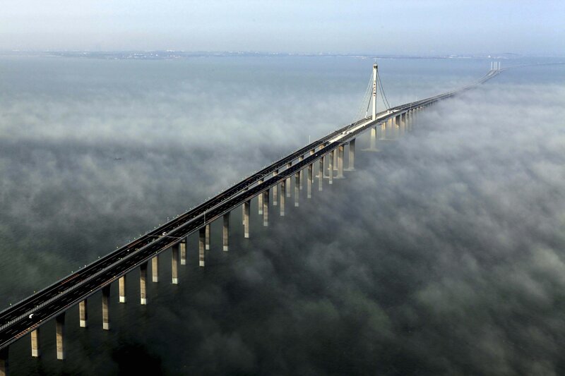 Bridge over foggy sea