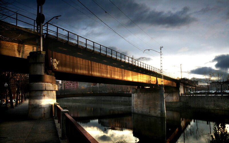 Bridge over river at dusk
