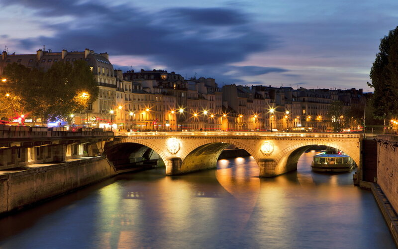 Bridge over River at Night — Blue, Serene, Photograph, Buildings, Boat