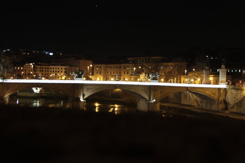 Bridge over river at night