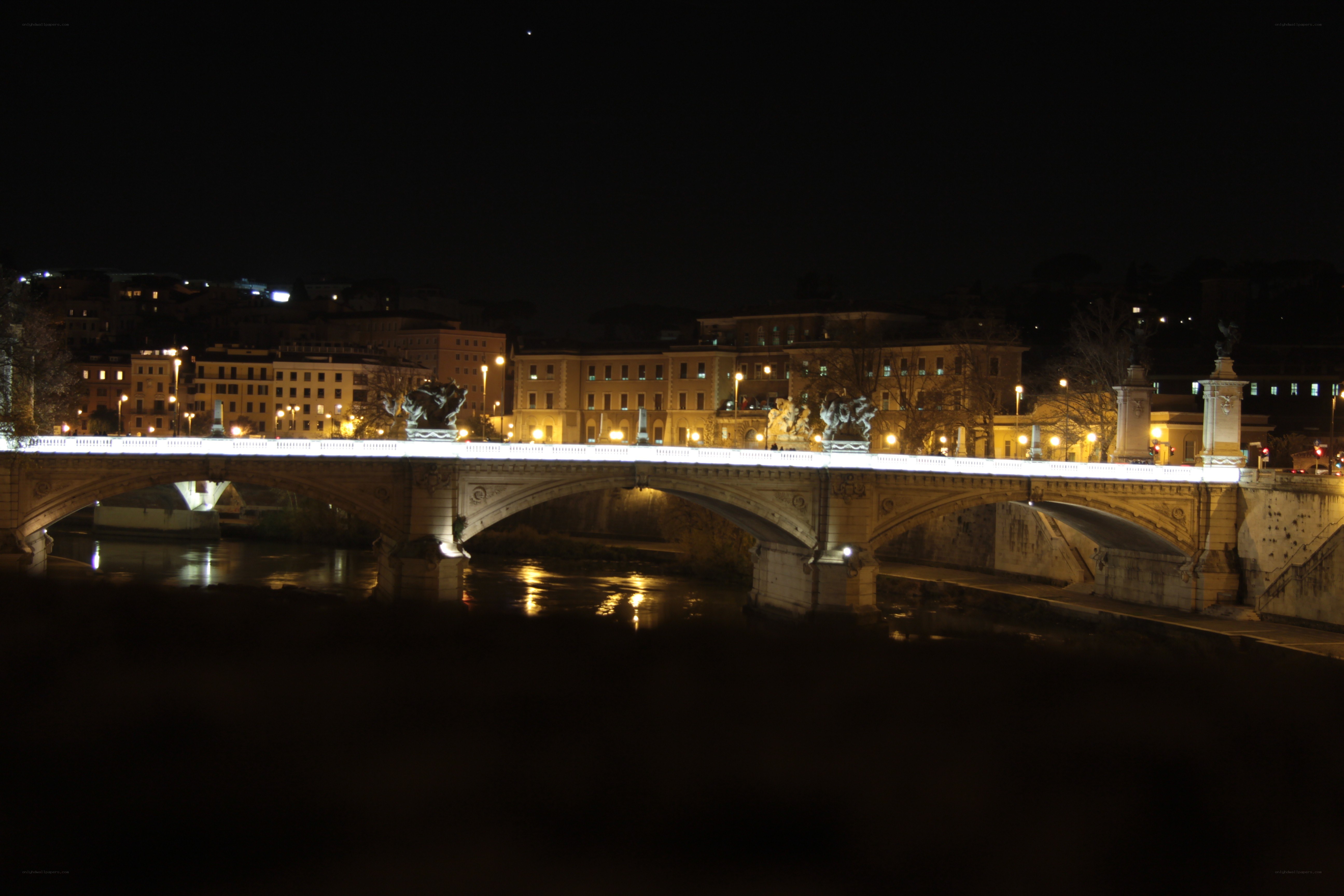 Bridge over river at night