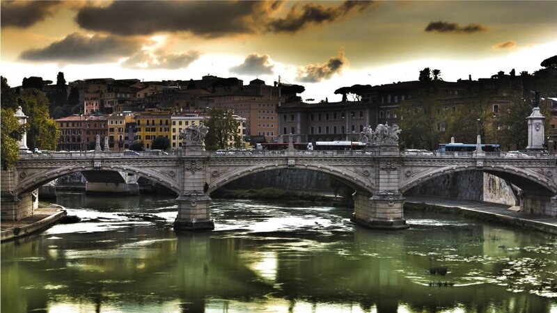 Bridge over river at sunset