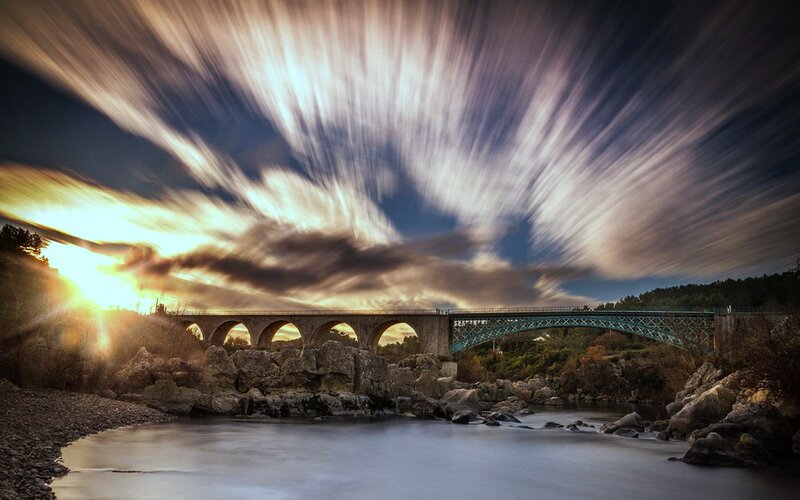 Bridge over River at Sunset — Blue, Dramatic, Photograph, Rocks