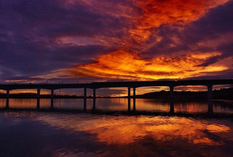 Bridge over River at Sunset — Orange, Dramatic