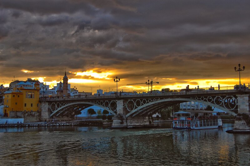 Bridge over River at Sunset — Yellow, Dramatic, Photograph, Boat, Crane