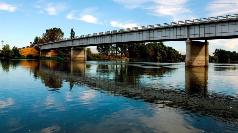Bridge over River — Blue, Serene, Afternoon, Photograph, Trees, Sky, Green