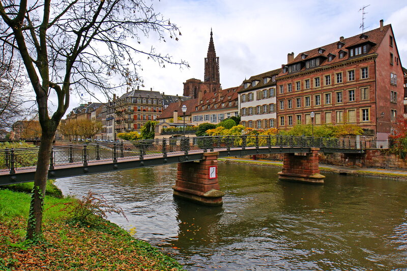 Bridge over River in City — Brown